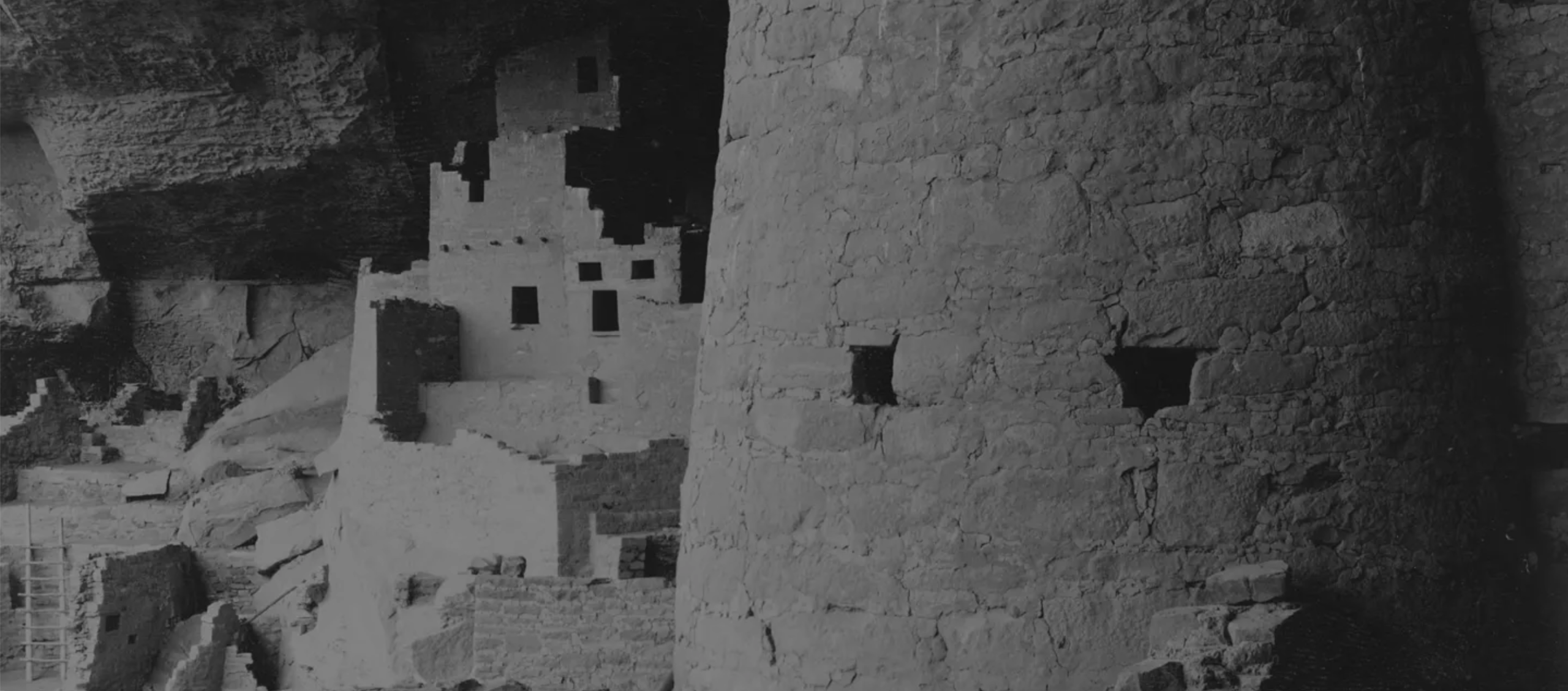 B&W Image shows ancient stone buildings